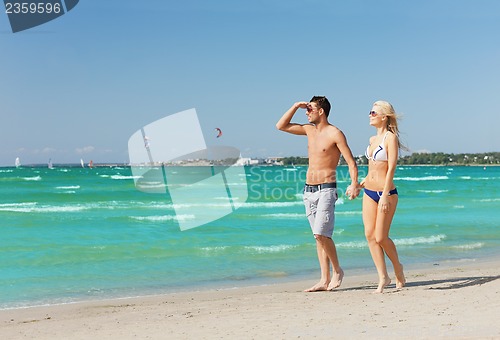 Image of couple walking on the beach