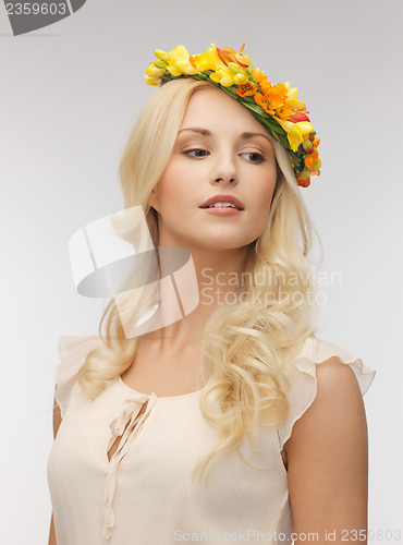 Image of woman wearing wreath of flowers