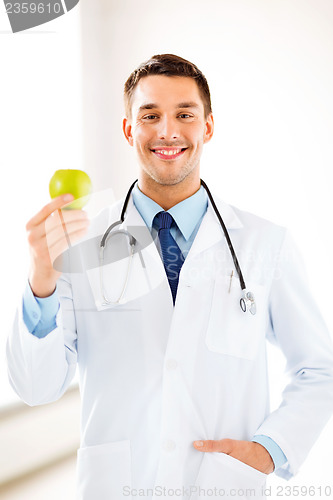 Image of male doctor with green apple