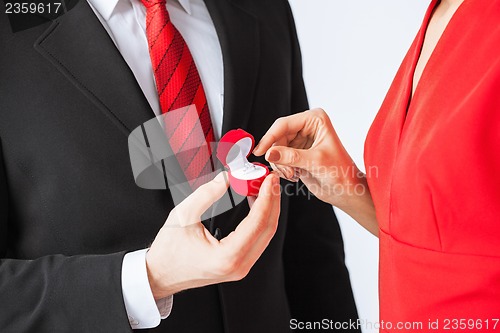 Image of couple with wedding ring and gift box