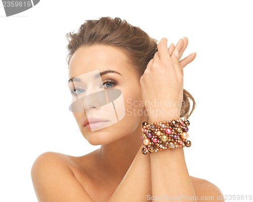 Image of woman wearing bracelet with beads