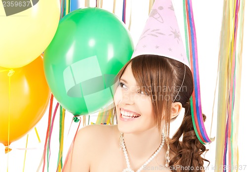 Image of happy girl with colorful balloons