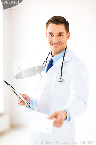 Image of male doctor writing prescription