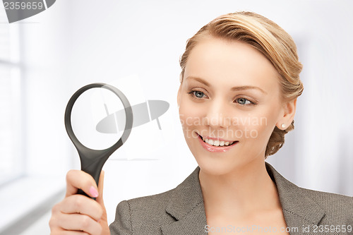 Image of woman with magnifying glass