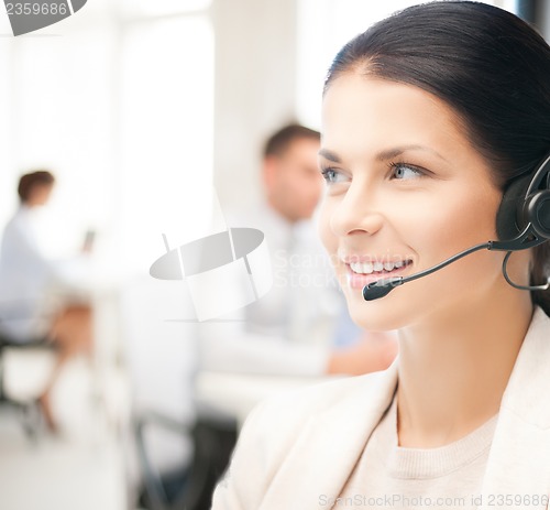 Image of female helpline operator in call center