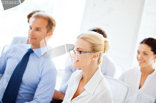 Image of businessmen and businesswomen on conference