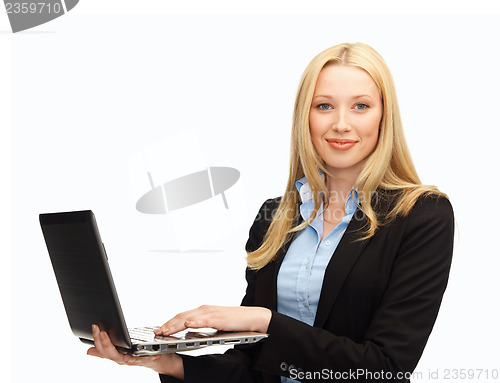 Image of smiling woman with laptop computer