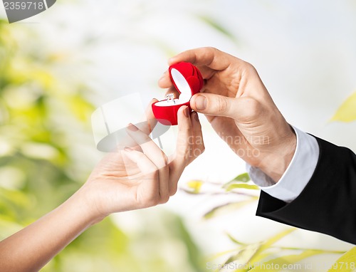 Image of couple with wedding ring and gift box