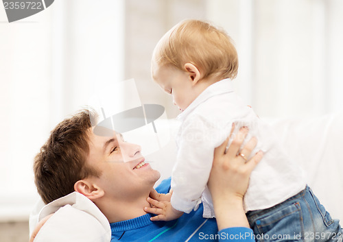 Image of happy father with adorable baby