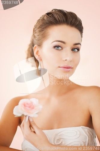 Image of woman with diamond earrings