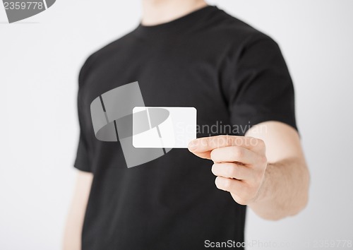 Image of man hand with blank paper