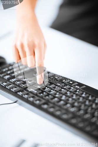 Image of woman hands typing on keyboard