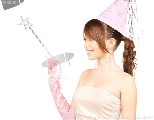 Image of girl in party cap with magic stick