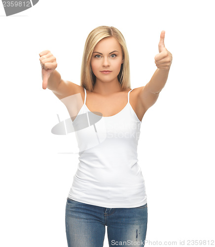 Image of woman with thumbs up and down