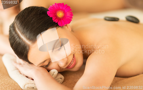 Image of woman in spa with hot stones