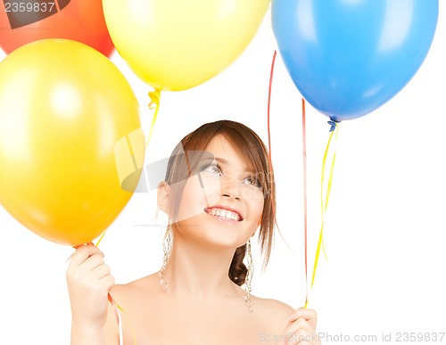 Image of happy girl with colorful balloons