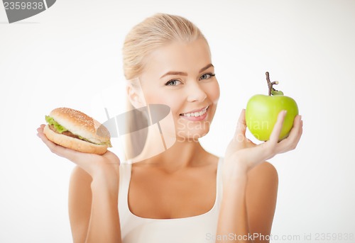 Image of woman with apple and hamburger