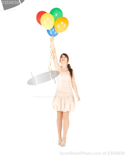 Image of happy girl with colorful balloons