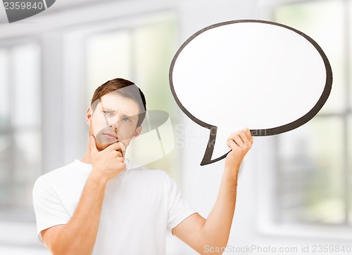 Image of young man with blank text bubble