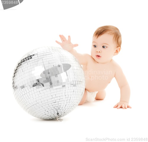 Image of child playing with disco ball