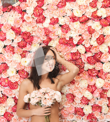 Image of woman and background full of roses