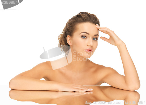 Image of woman with mirror