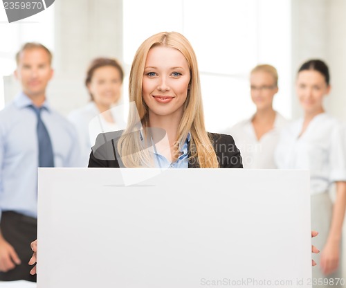 Image of businesswoman with white blank board