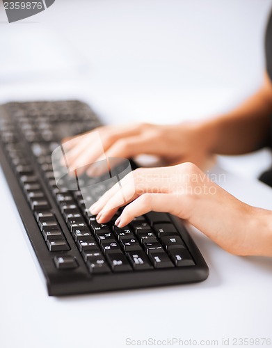 Image of woman hands typing on keyboard