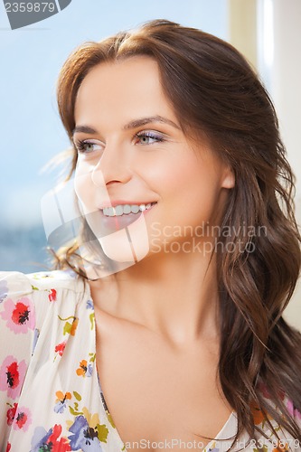 Image of picture of smiling woman at home