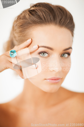 Image of woman with one jewelry ring