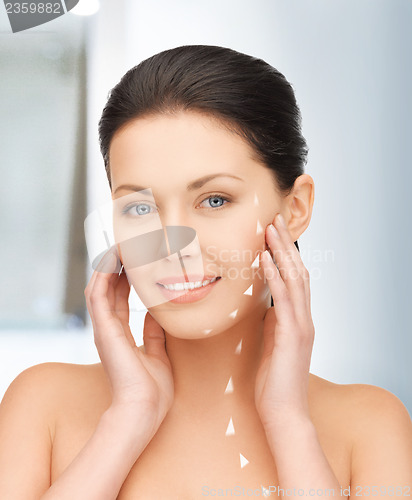 Image of face and hands of beautiful woman
