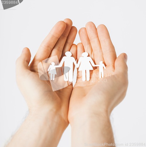 Image of man hands with paper men