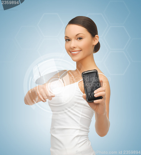 Image of woman showing smartphone with app