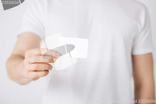 Image of man hand with blank paper