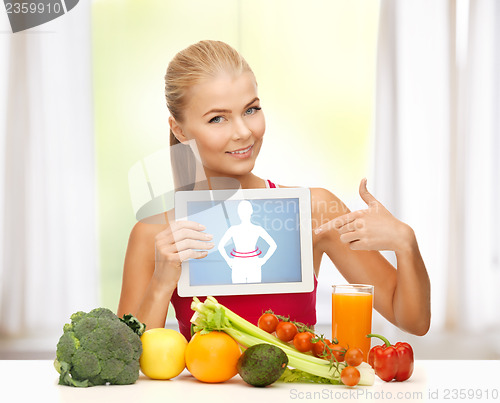 Image of woman with fruits, vegetables and tablet pc