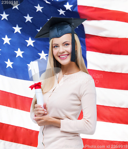 Image of student in graduation cap with certificate