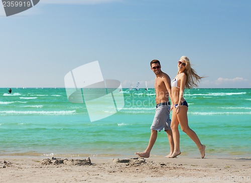 Image of couple walking on the beach