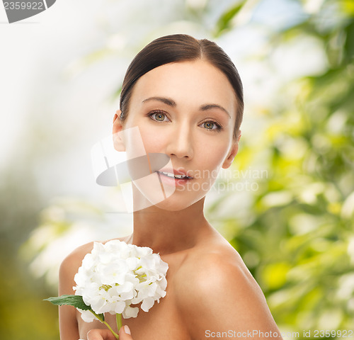 Image of beautiful woman with white flower