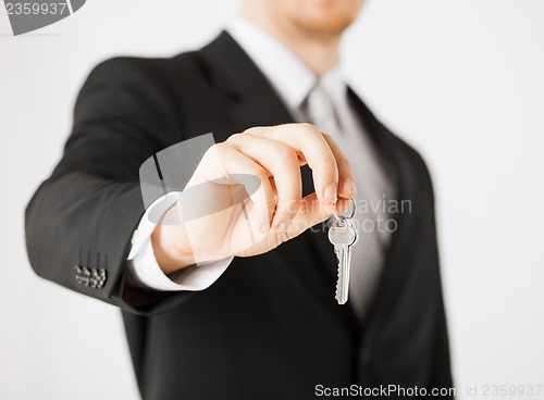 Image of man holding house keys