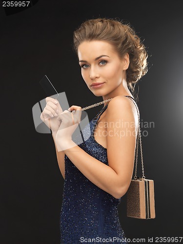 Image of woman in evening dress with vip card