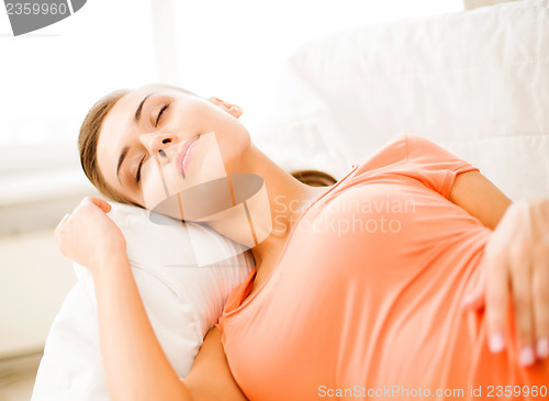 Image of woman sleeping on the couch at home