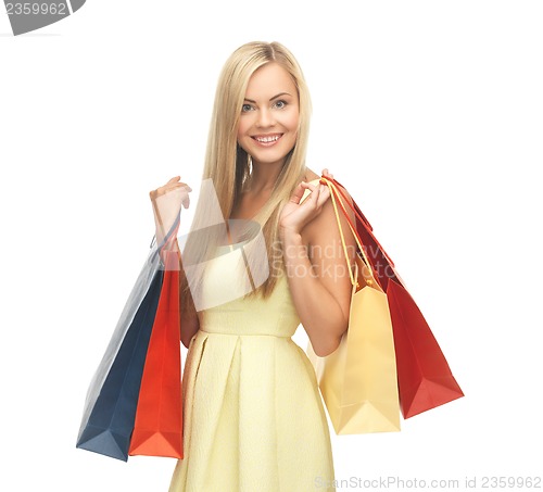 Image of excited woman with shopping bags