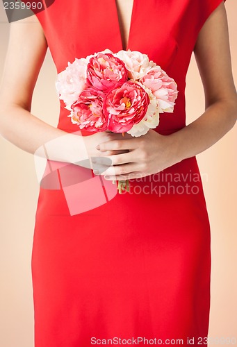 Image of woman hands with bouquet of flowers