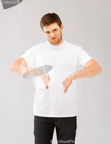 Image of man showing thumbs down