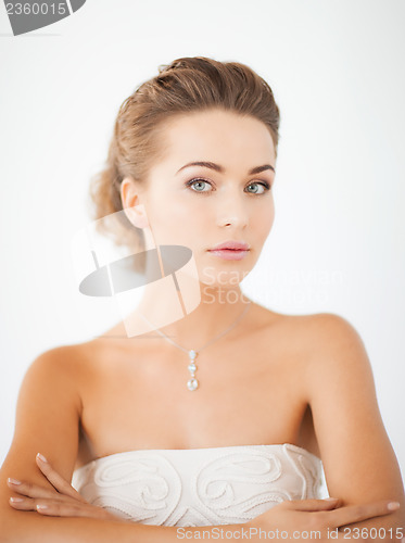 Image of woman with diamond necklace