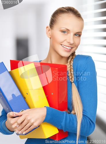 Image of happy woman with folders