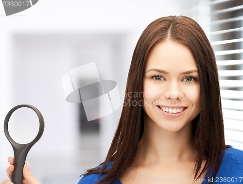 Image of woman with magnifying glass