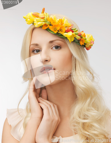 Image of woman wearing wreath of flowers