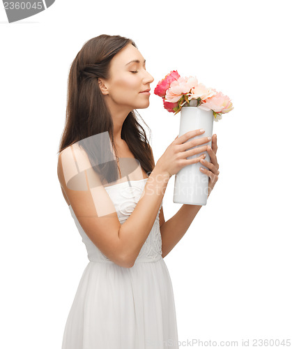 Image of woman with vase of flowers