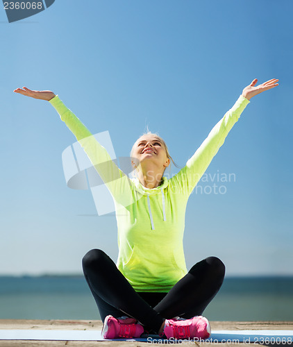 Image of woman doing yoga outdoors